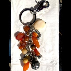 Polished stone key fob in earth tones